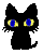 a small black cat sitting